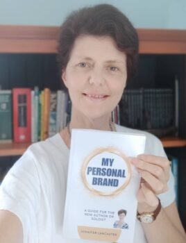 Business Publisher Jennifer holding a personal brand book