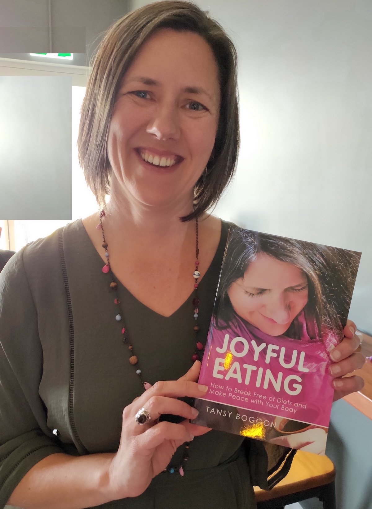 TANSY BOGGON Holding Her Book JOYFUL EATING